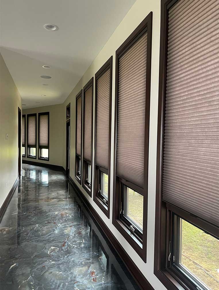 Hallway of windows covered by honeycomb shades